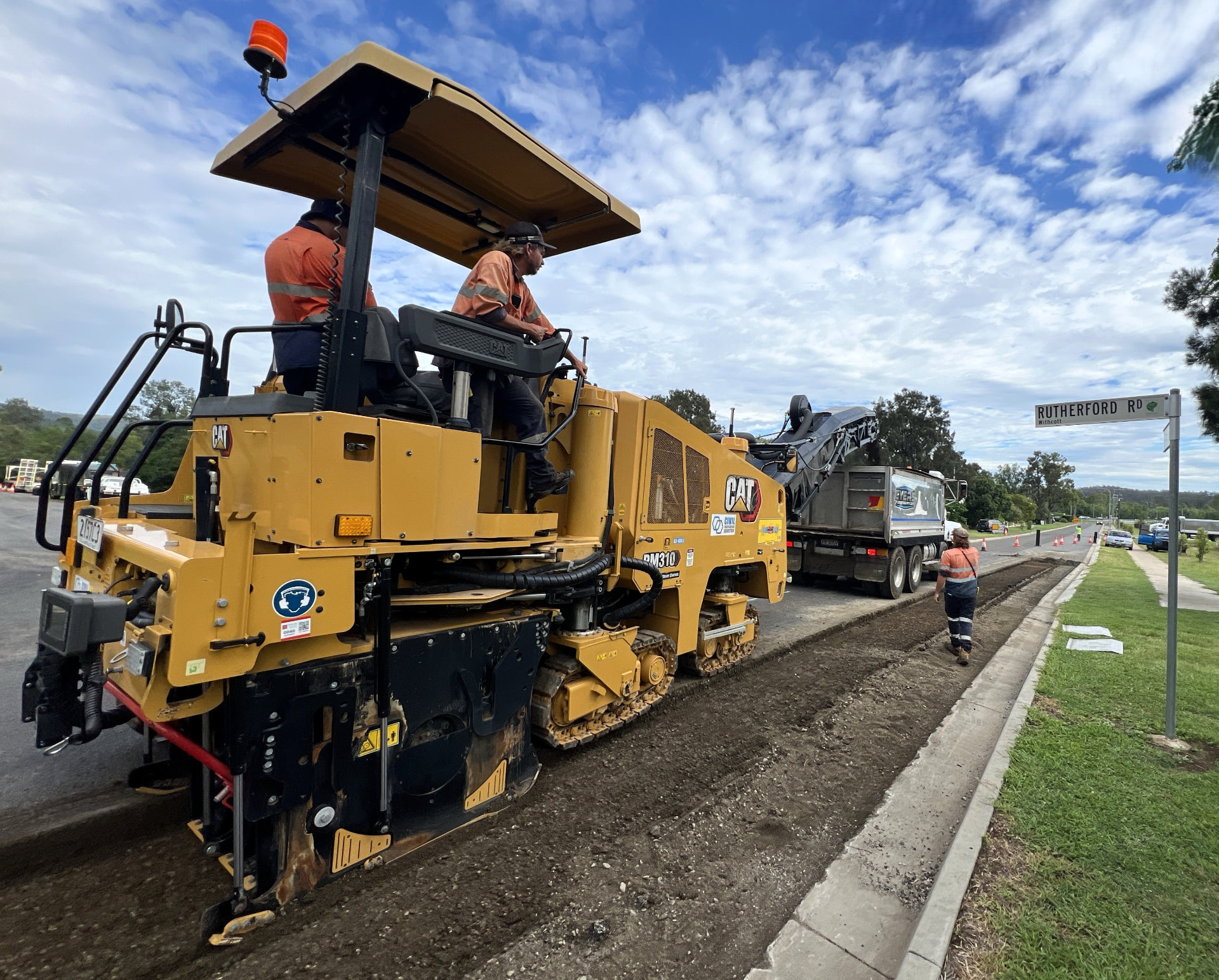 Civil Independence Industries CAT PM310 profiler removing asphalt pavement ahead of resurfacing